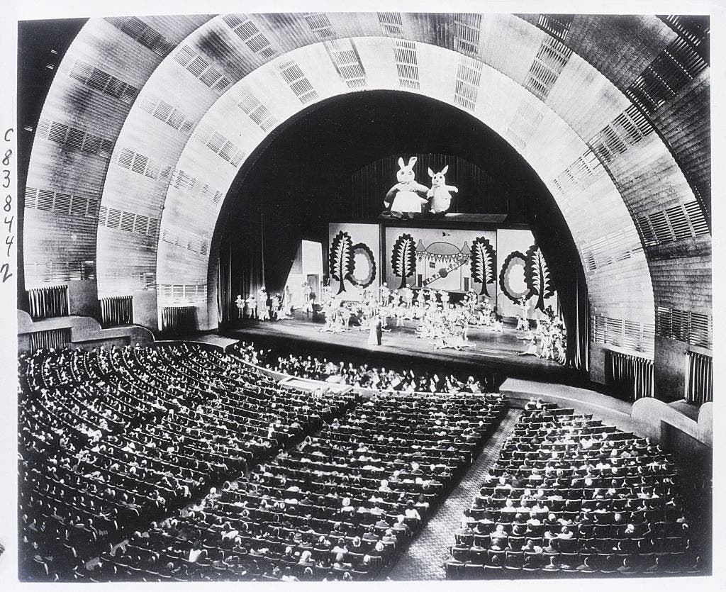 New York, New York: This striking photo of the interior of the Radio City Music Hall in Rockefeller Center was taken of the world's largest theater. Presenting an unusual photographic problem, it was made during an actual stage presentation under normal house lighting conditions while an audience of 6,200 persons was watching the finale of one of the great spectacles that have become associated with the name of the place. (Getty Images)