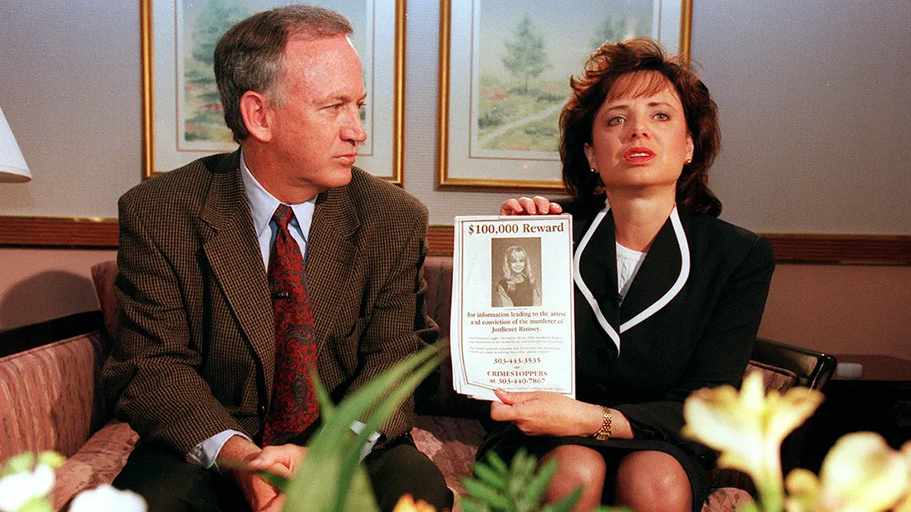 BOULDER, CO - MAY 01: John and Patsy Ramsey, the parents of JonBenet Ramsey, meet with a small selected group of the local Colorado media after four months of silence in Boulder, Colorado on May 1, 1997. Patsy holds up a reward sign for information leading to the arrest of their daughter's murderer. Their 6-year-old daughter was found dead on Christmas night 1996. (Helen H. Richardson/ The Denver Post)