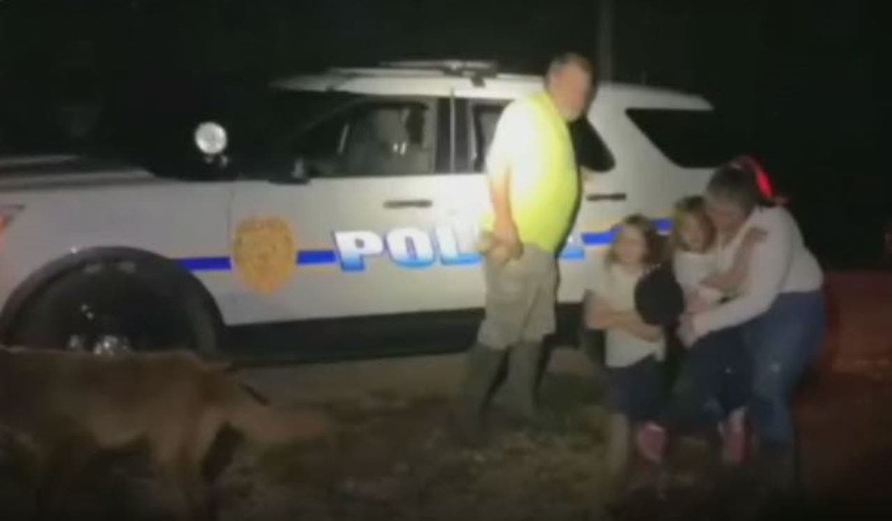 Louisiana dog hailed a hero for protecting young girls lost in woods for hours