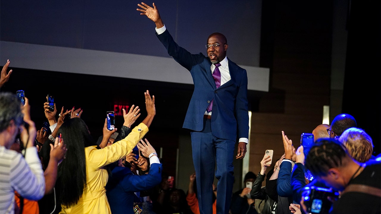 Democratic Sen. Raphael Warnock arrives at election night party