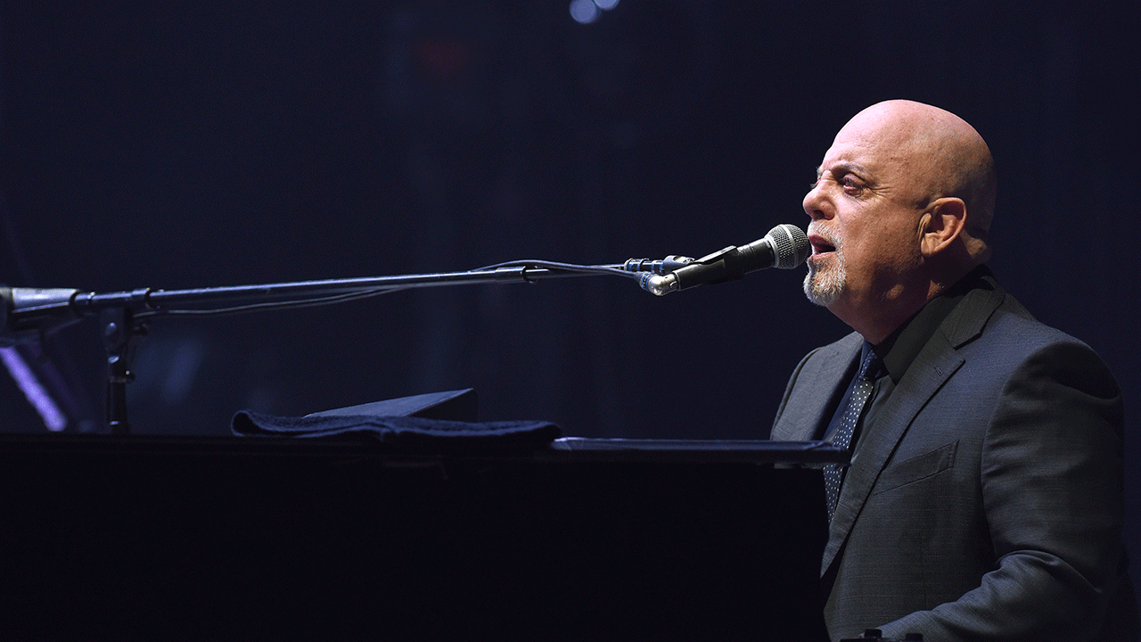 Billy Joel playing the piano