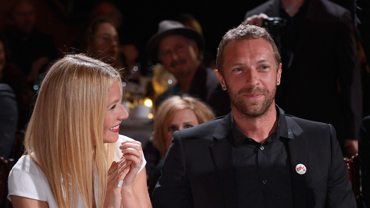 Gwyneth Paltrow laughing with Chris Martin