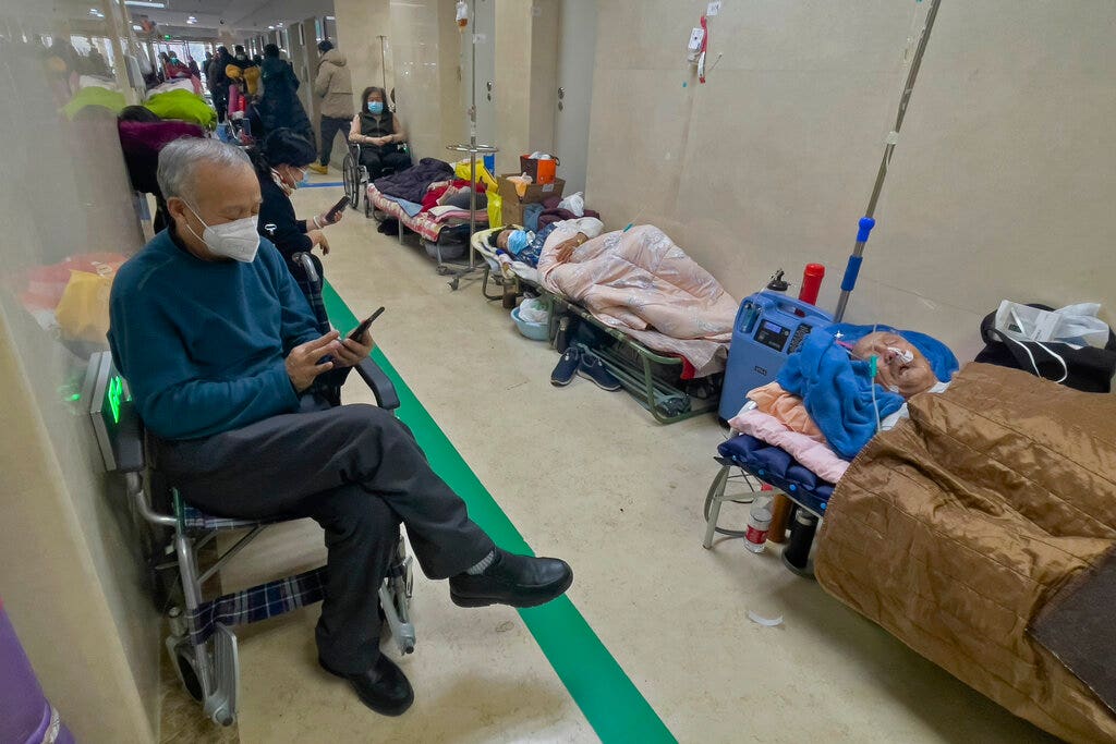 China’s coronavirus crisis: The Beijing hospital runs out of beds, and families cremate corpses in the streets as deaths rise