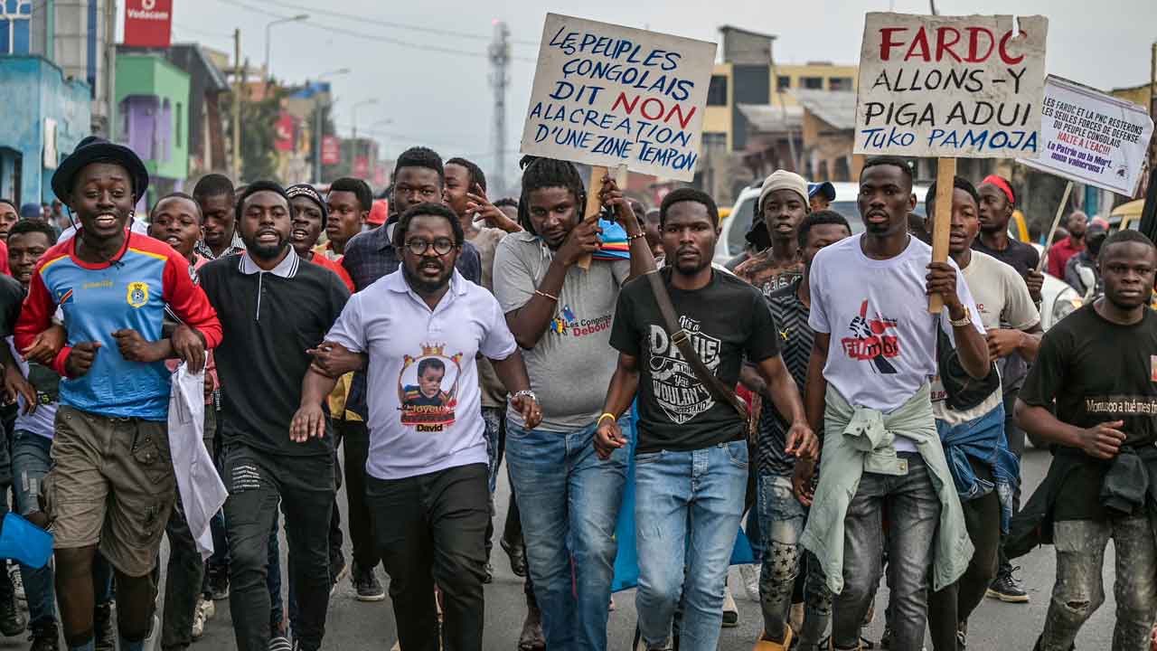 Congo police fire tear gas at unauthorized protestors opposing the presence of foreign troops