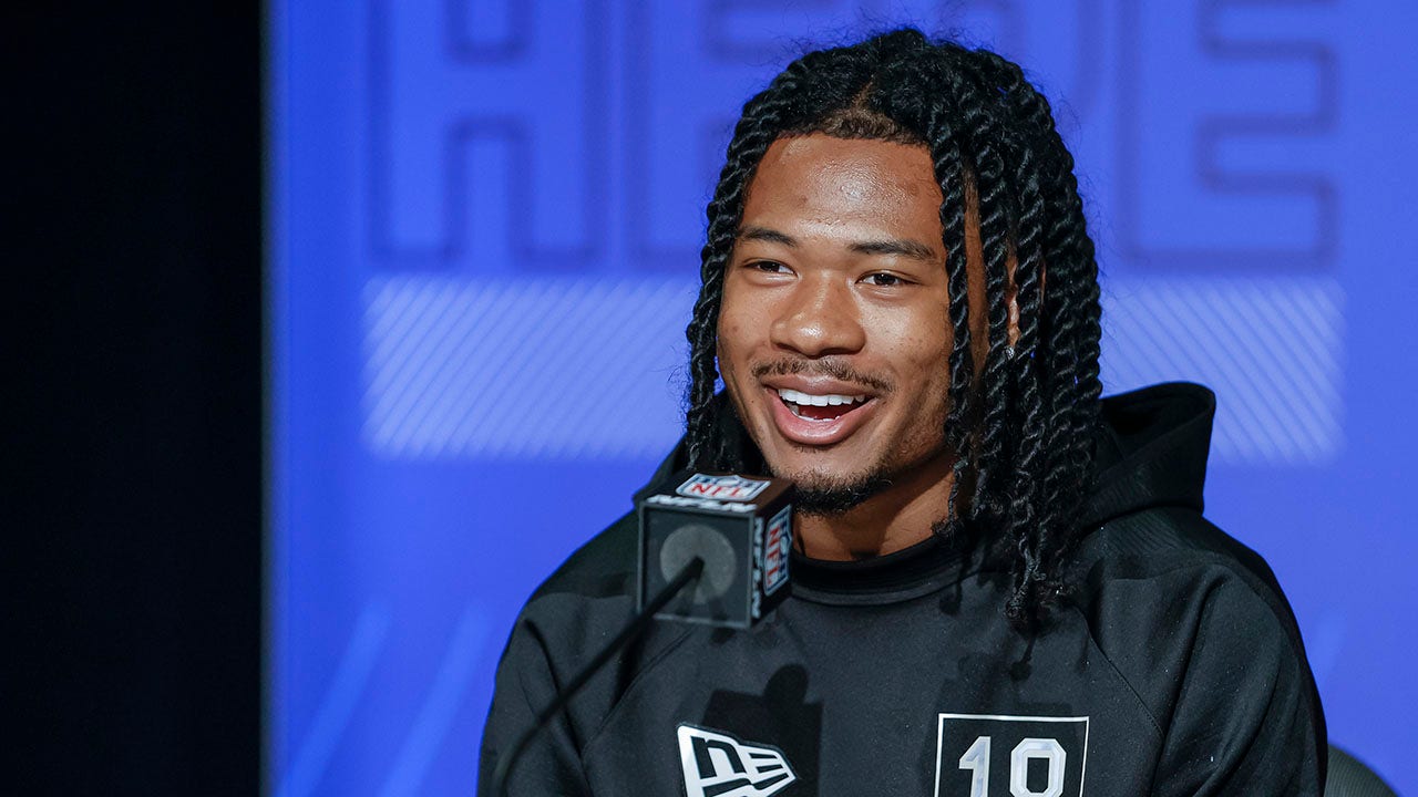 John Metchie speaks to reporters at the NFL Draft Combine