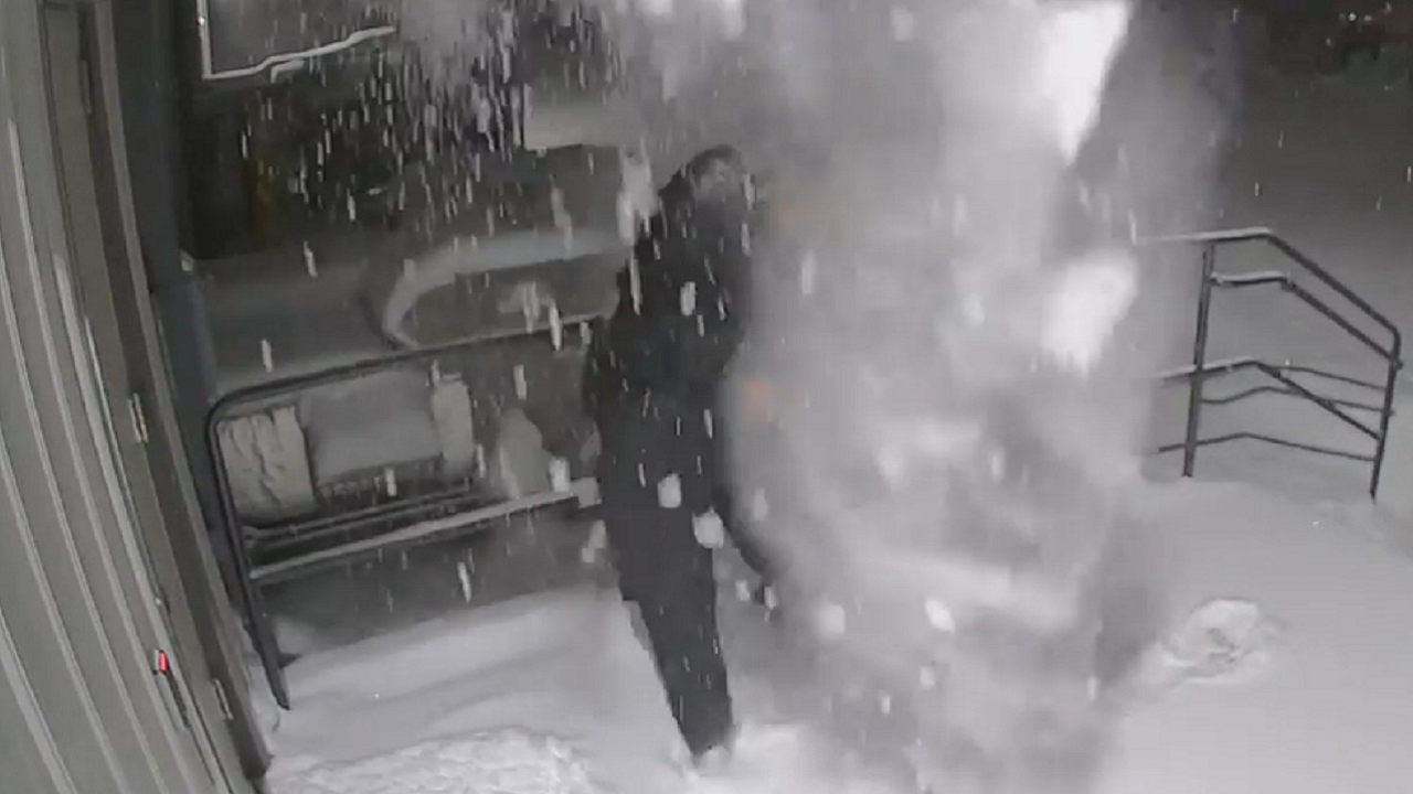 Video shows Wisconsin police officer getting snow dumped on him after closing door