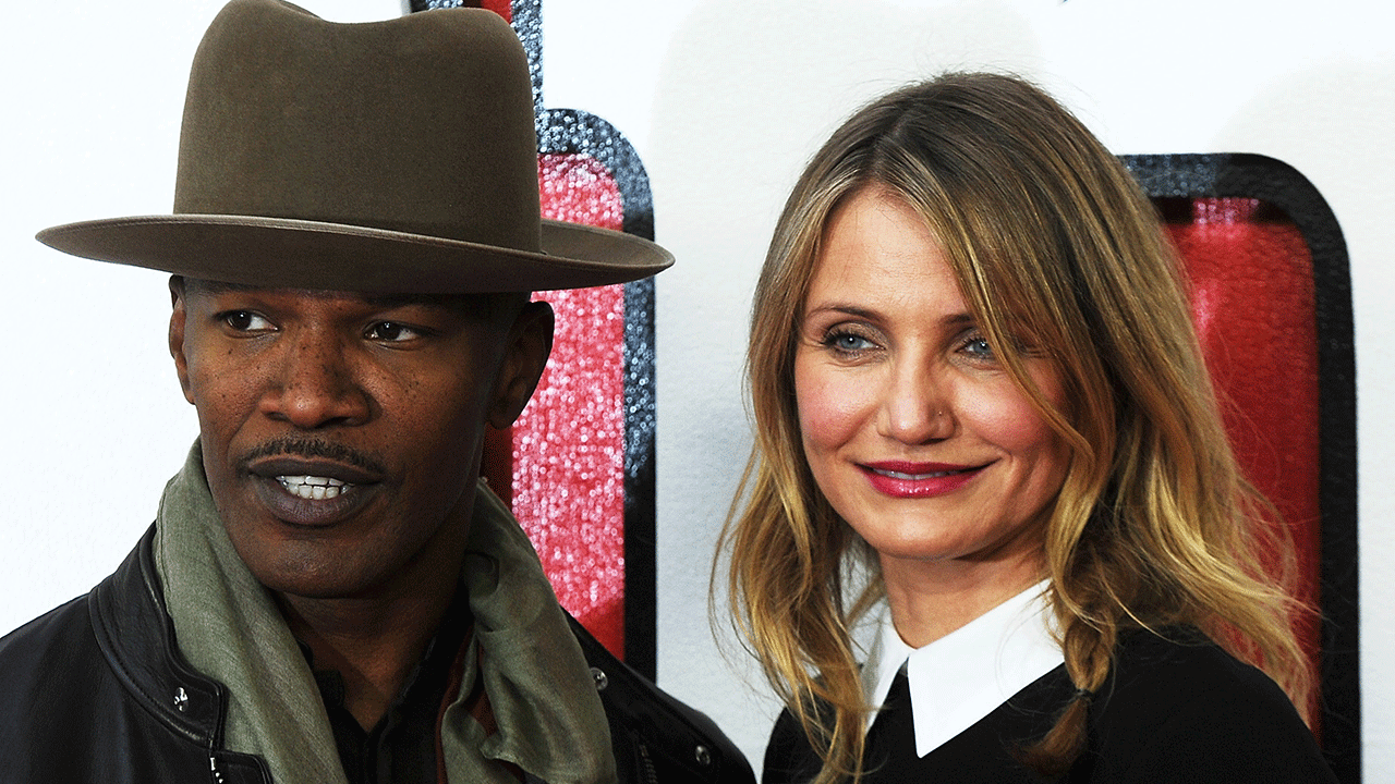 Jamie Foxx usa chapéu de aba larga no tapete vermelho com Cameron Diaz