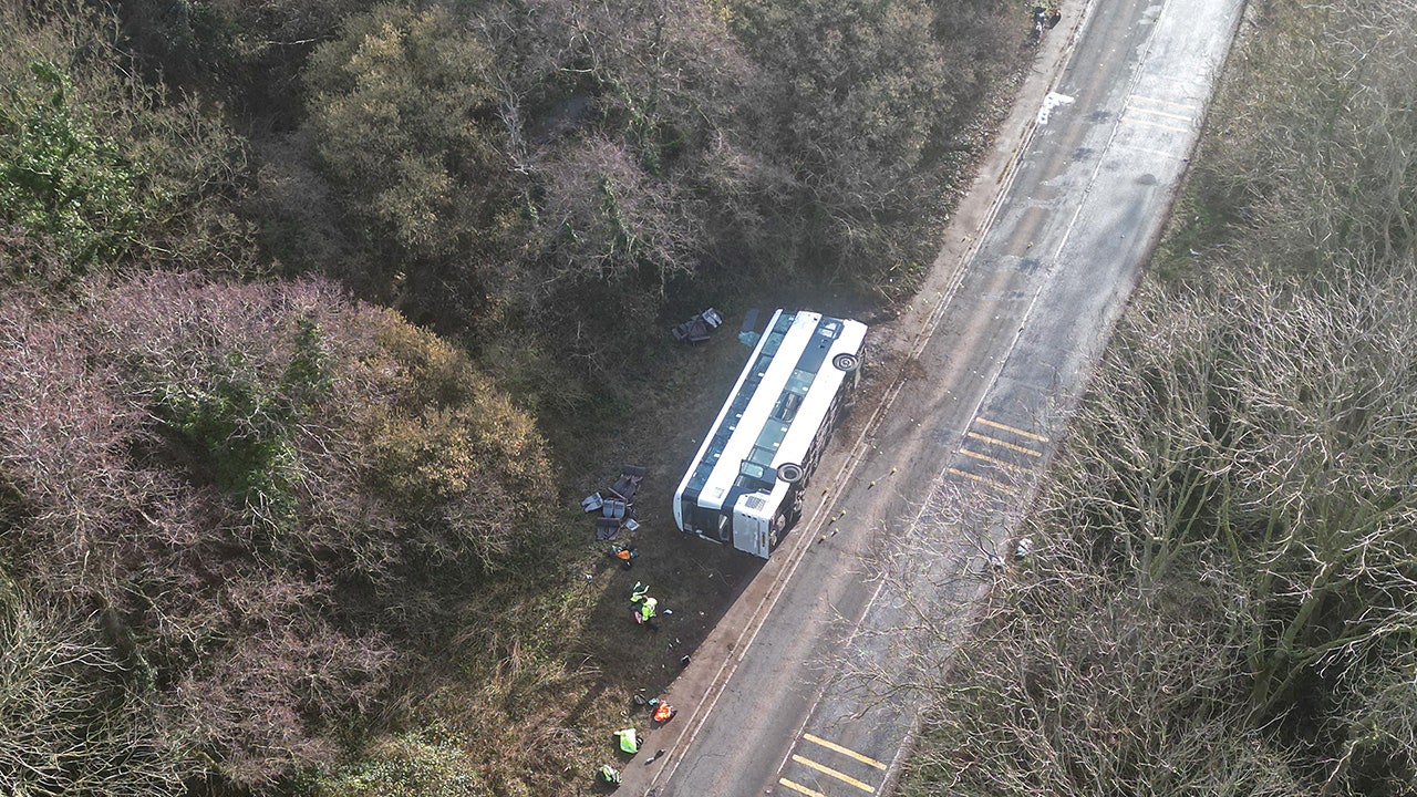 Double-decker bus in England overturns with 70 passengers aboard, dozens treated as 'walking wounded': police