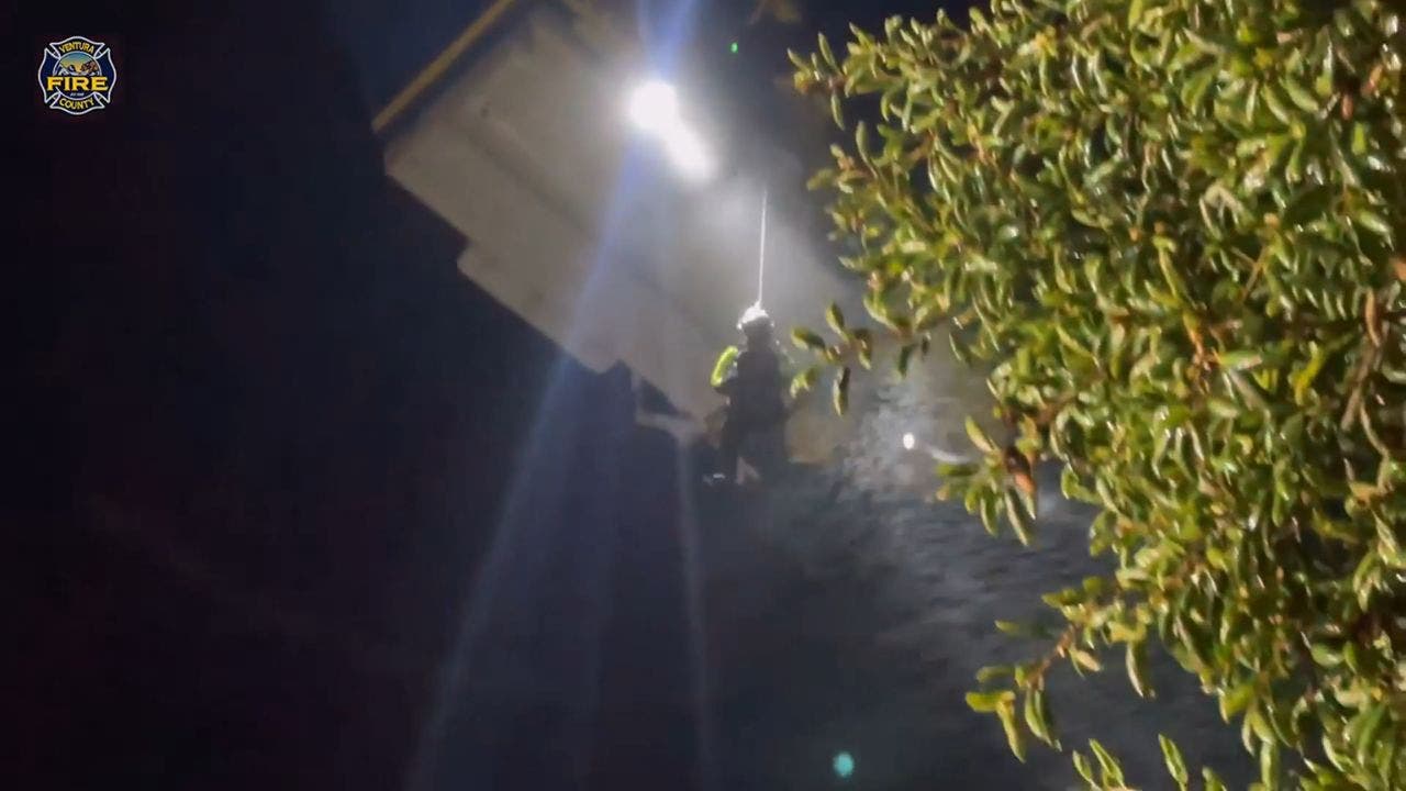 California firefighters caught on camera conducting daring aerial rescue of driver caught in flash flood