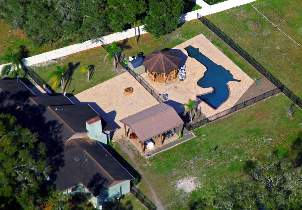 Florida couple shows off backyard pool shaped like revolver: 'You swim your lap down the barrel'