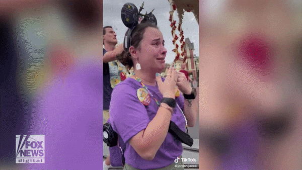 Disney Adults' become online talking point after woman falls to her knees  at Disney World