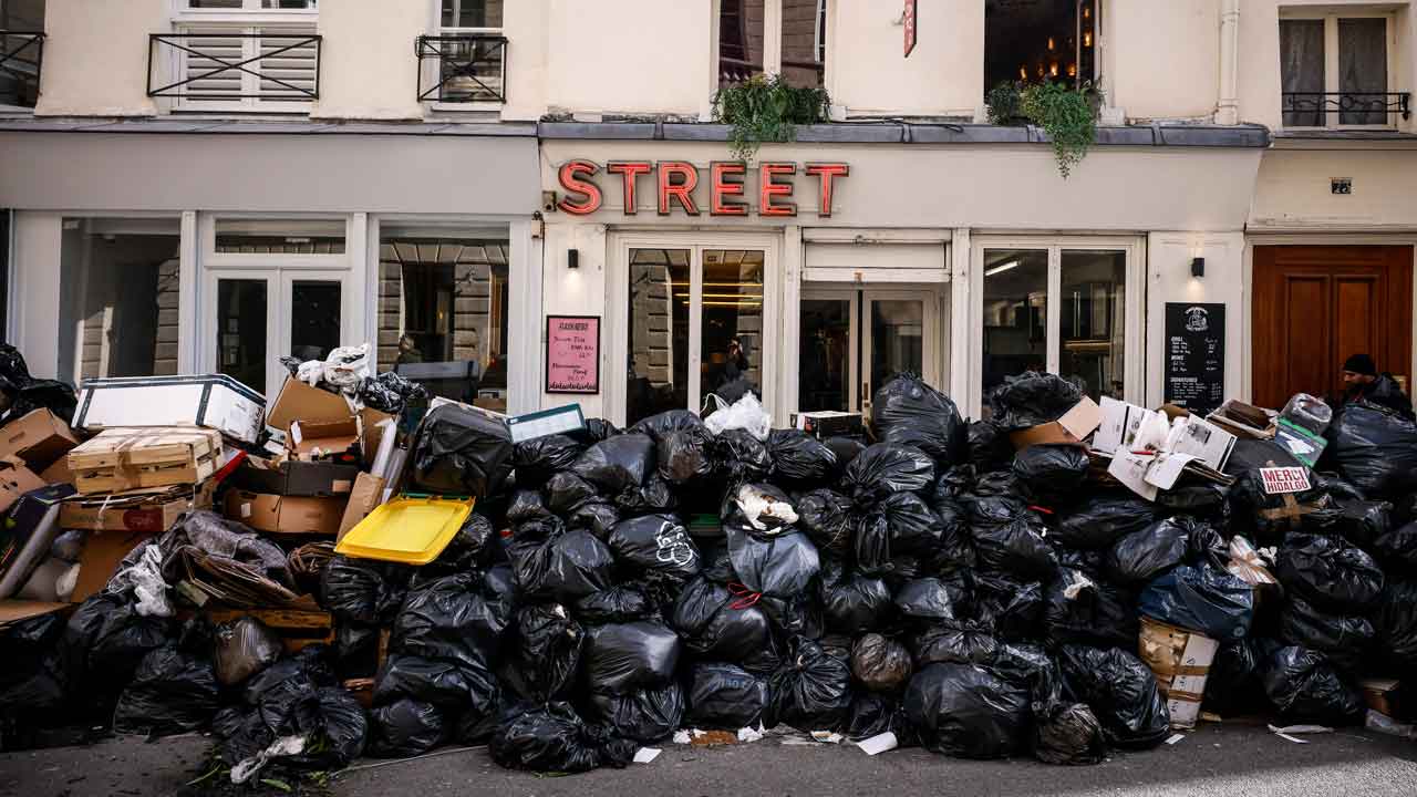 Garbage fills the streets of Paris as sanitation workers continue strike against pension reform bill
