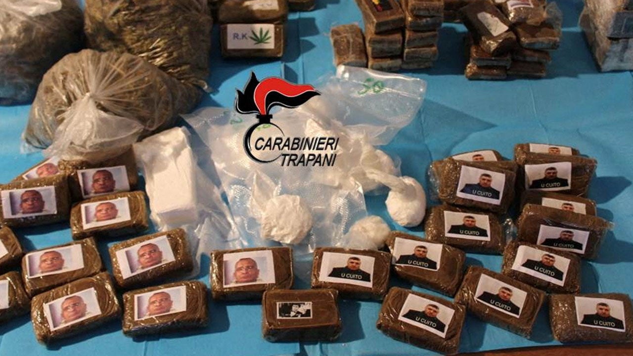Italian police seize cache of drugs decorated with face of Mafia leaders