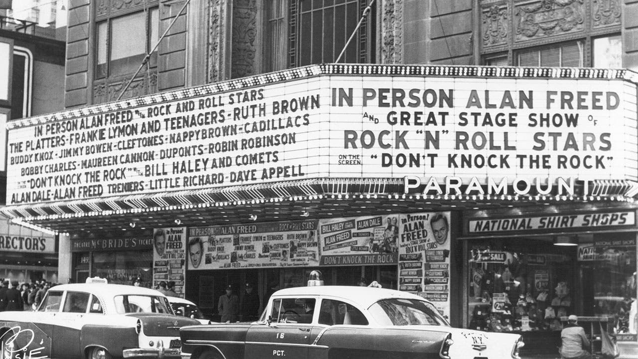 Photo of marquee at unspecified theater promoting a rock 'n' roll concert hosted by DJ and early rock figure Alan Freed. The marquee also highlights 