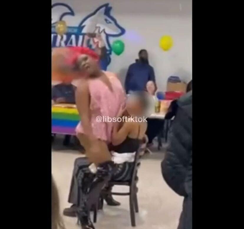 Drag queen performs lap dance on student and gyrates in front of cheering  children