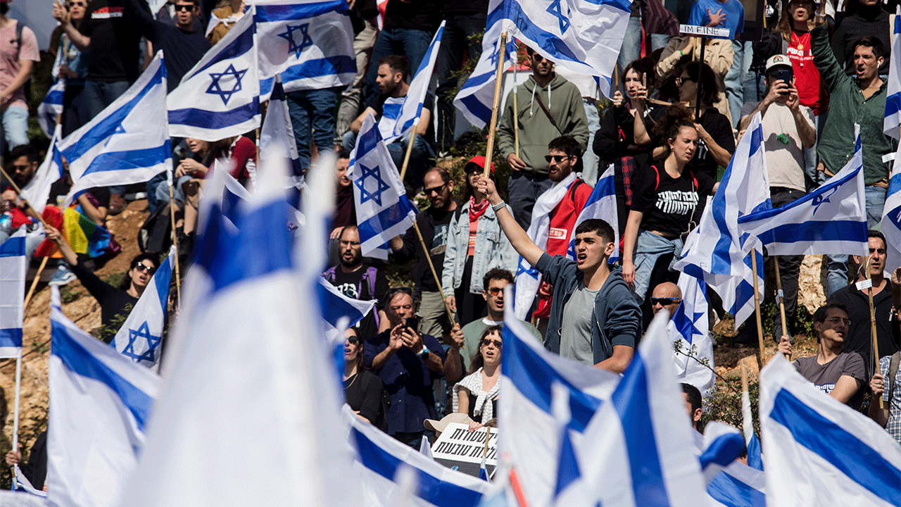 Protests in Israel waving Israeli flags