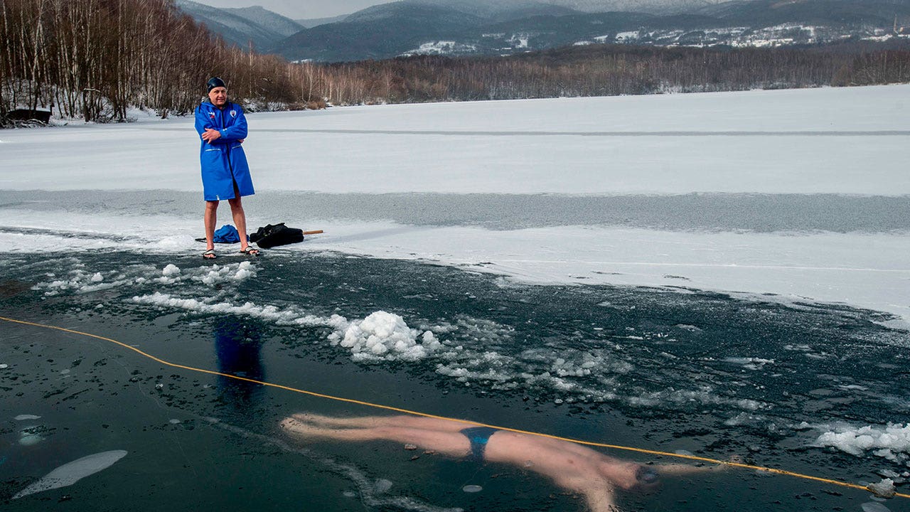 Free diver breaks record depth at 170 feet beneath frozen Swiss lake
