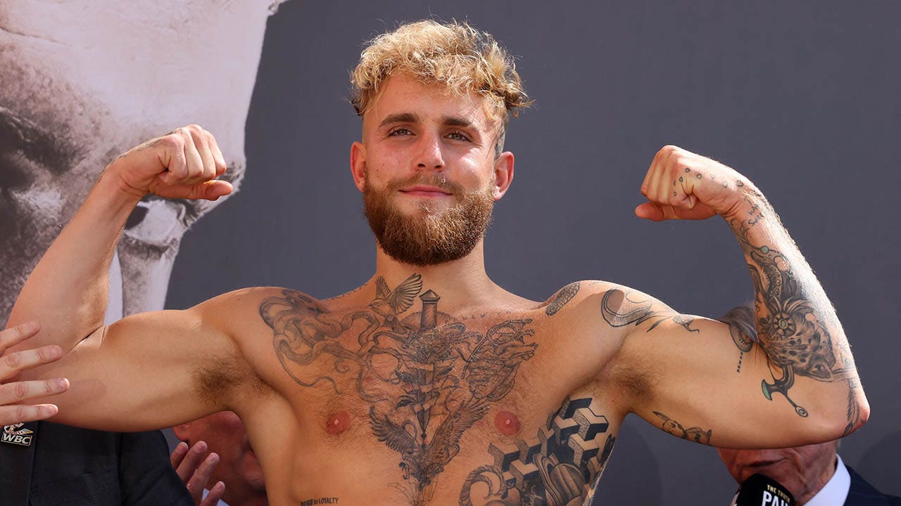 Jake Paul gets gotcha hat tattoo in taunt to Floyd Mayweather after mass  brawl breaks out at brother Logans face off  The Sun