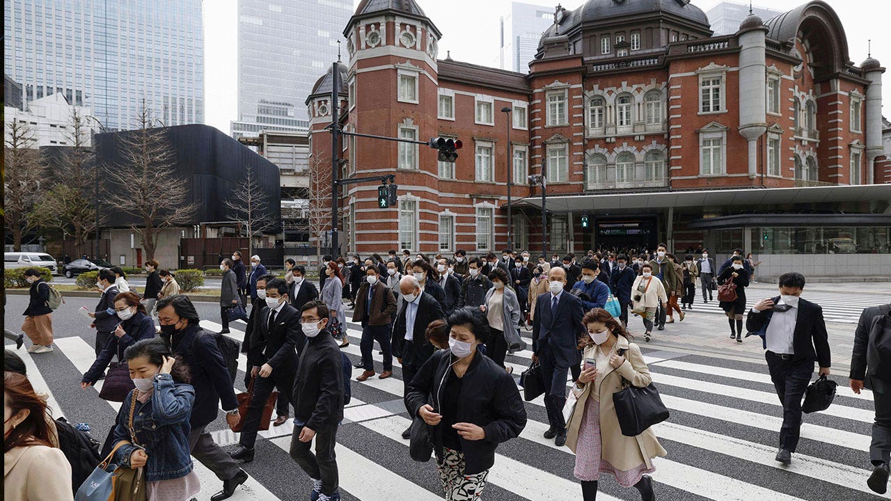 Japanese residents continue to wear masks after 3-year-long request ends