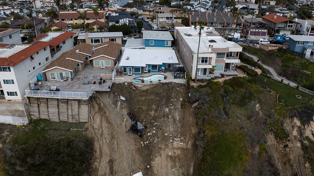 California buildings still endangered by tumbling oceanside hill, dozens forced to flee