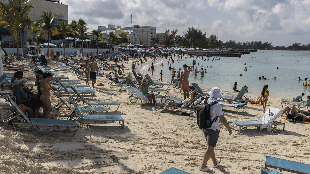 Tourists on the beach in Nassau, Bahamas