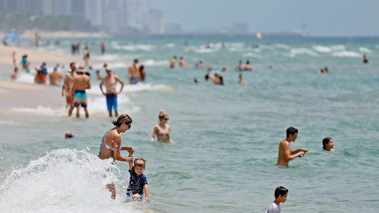 A beach filled with people