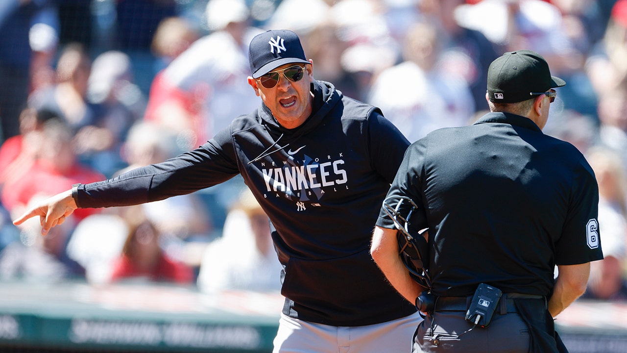 Baltimore, United States Of America. 11th July, 2018. New York Yankees  manager Aaron Boone (17) seems to be flexing his muscles in the dugout  prior to the game against the Baltimore Orioles