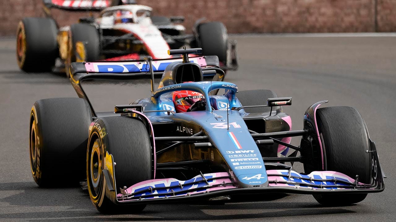 F1's Esteban Ocon narrowly avoids disaster as he zooms into pits with photographers awaiting race's end