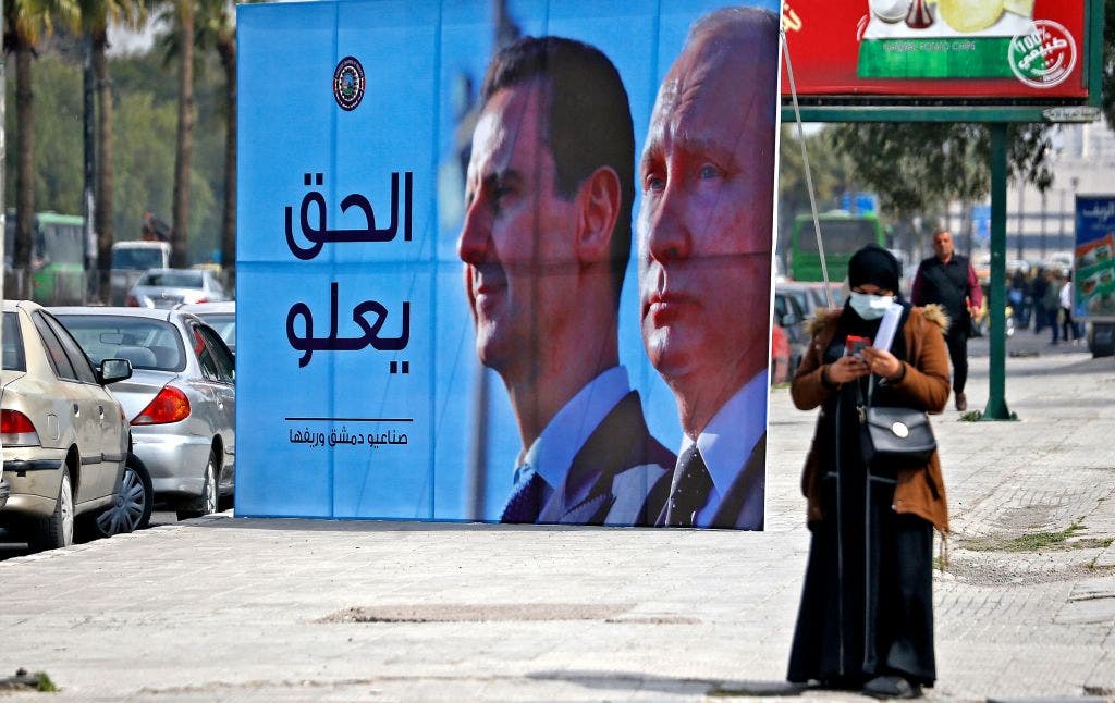 Assad- und Putin-Werbetafel