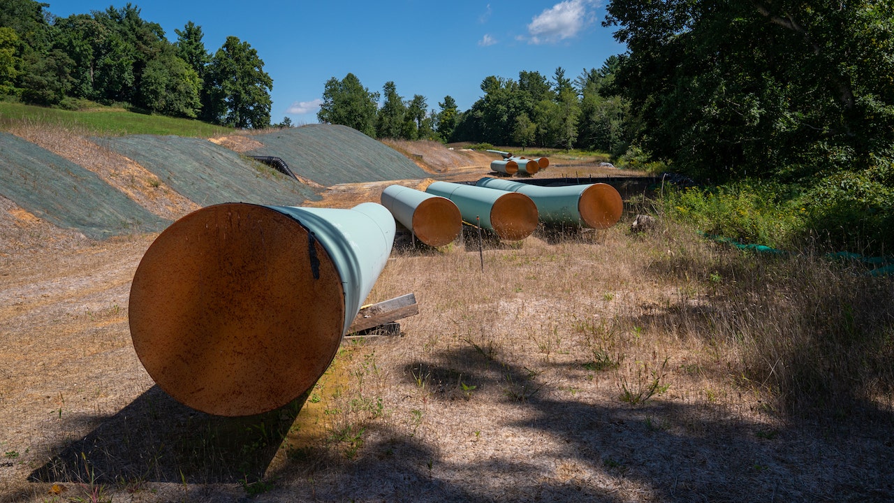 BENT MOUNTAIN, VIRGINIA - AUGUST 31: Sections of 42 diameter sections of steel pipe of the Mountain Valley Pipeline, MVP, lie on wooden blocks, August 31, 2022 in Bent Mountain, Virginia. The MVP will transport natural gas through 303 miles of West Virginia and Virginia. Public opposition has centered on challenging MVPs permitting through wetlands and national forests. The original budget of $3.5 billion is now estimated to be $6.2 billion. The Federal Energy Regulatory Control agency, FERC, has recently granted MVP another 4-years to complete. (Photo by Robert Nickelsberg/Getty Images)