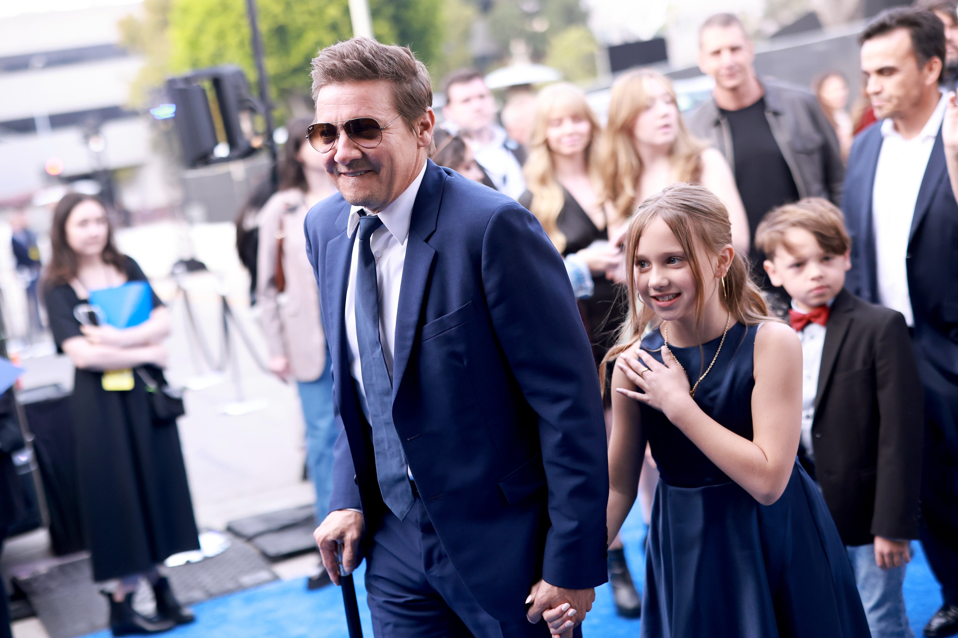 Jeremy Renner walks first red carpet with daughter's support after nearly dying in snowplow accident