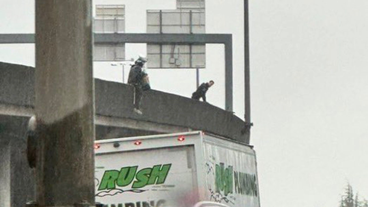 Cops walk homeless woman with bag on head off busy Seattle bridge: 'Just another day in the Emerald City'