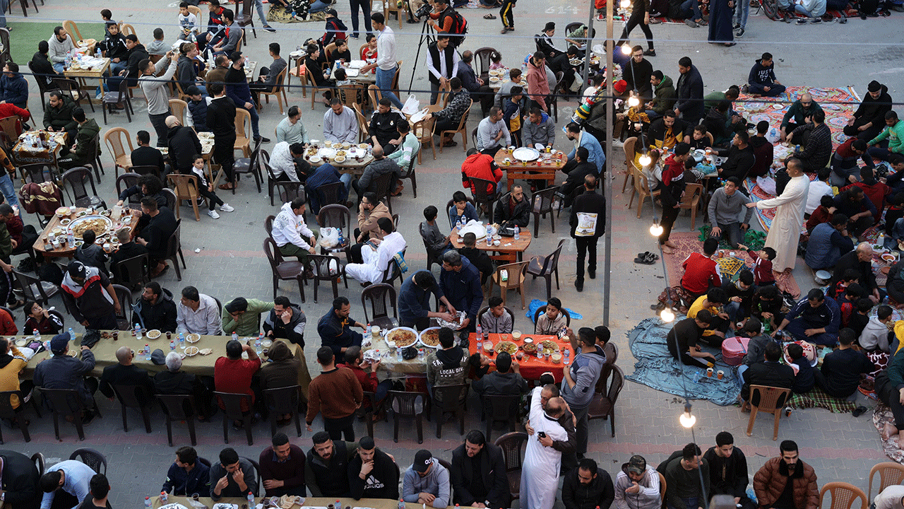 Families come together for a nightly feast, called iftar, after fasting all day during Ramadan.