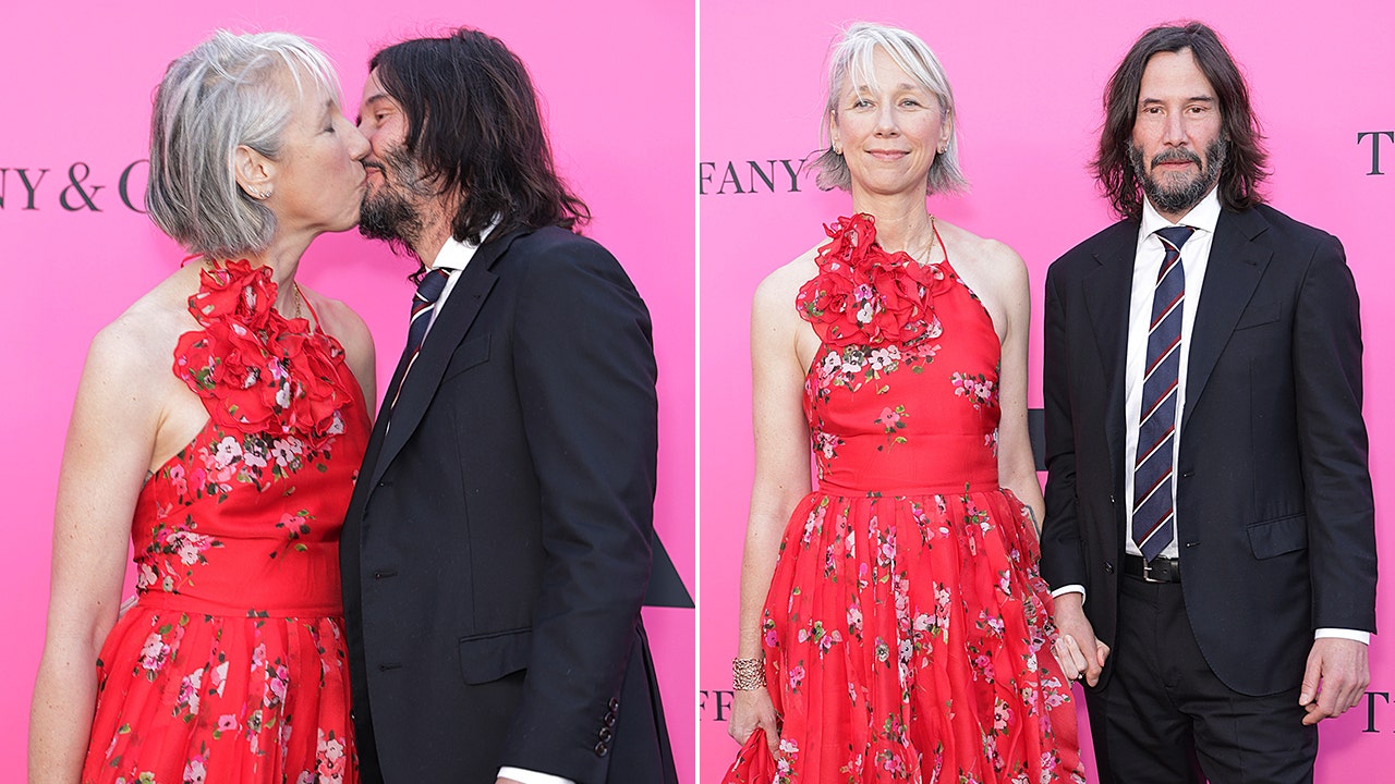 Keanu Reeves packs on PDA with girlfriend in rare red-carpet appearance ...