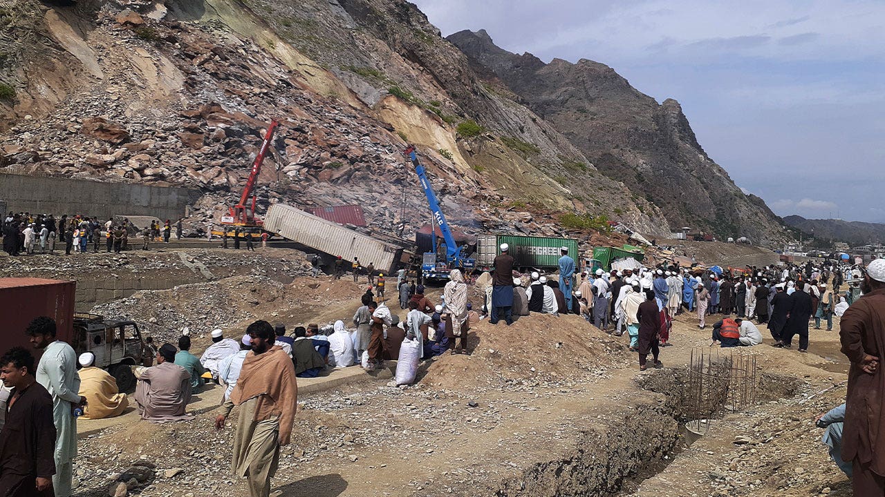 Massive landslide in Pakistan buries 2 dozen trucks, kills 2
