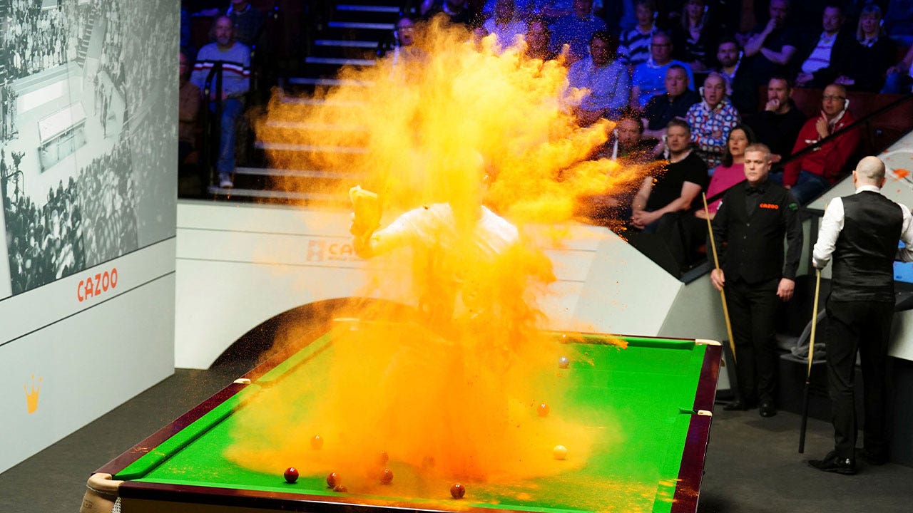 Snooker table vandalized by climate activist during world championship