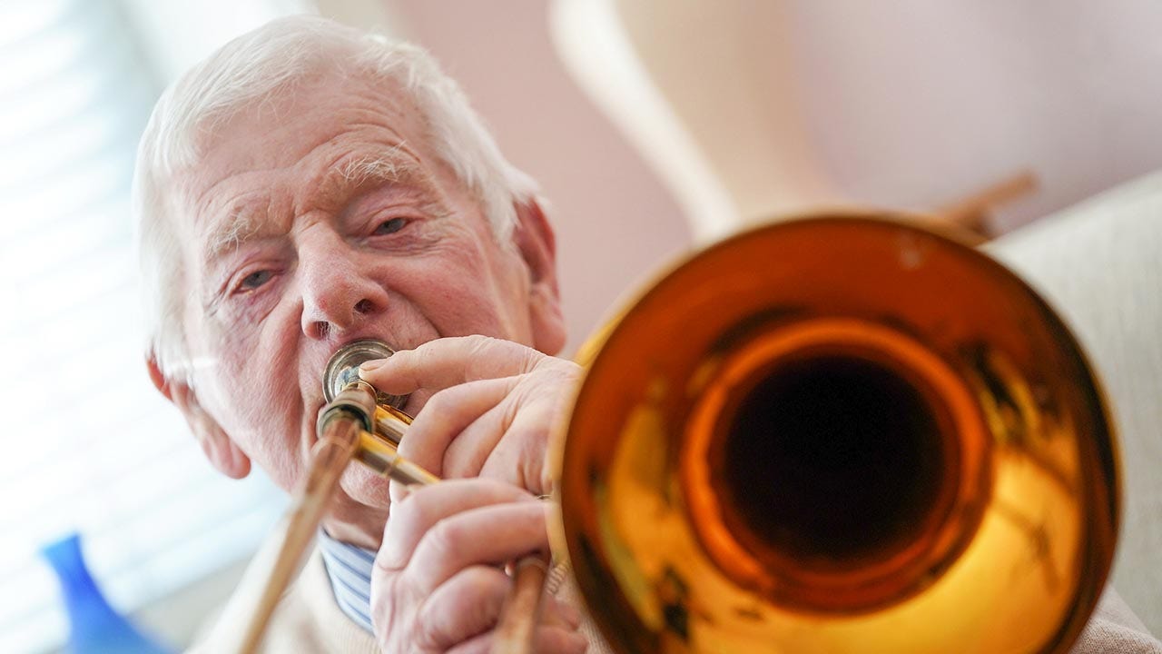 For King Charles' coronation, world's longest serving brass band player, 95, can toot his own horn