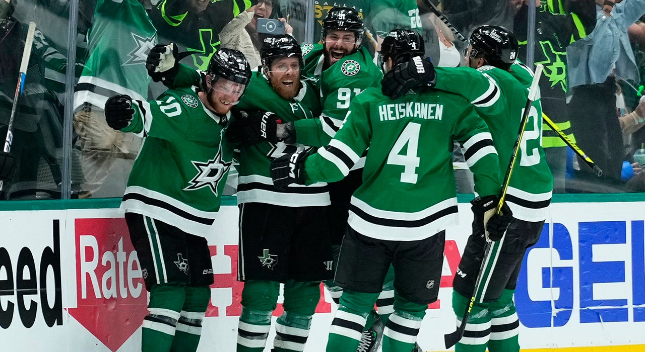 Dallas Stars center Joe Pavelski, center, celebrates with right