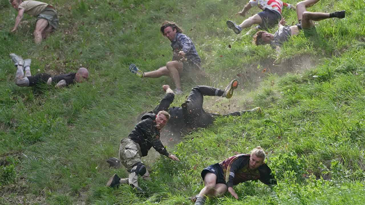 Hundreds gather for annual Cooper's Hill cheese-rolling race in southwest England