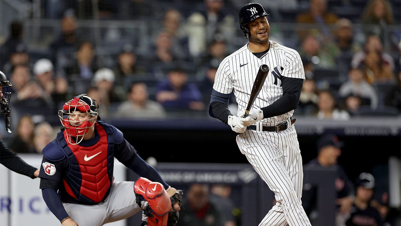 Aaron Hicks reacts after striking out