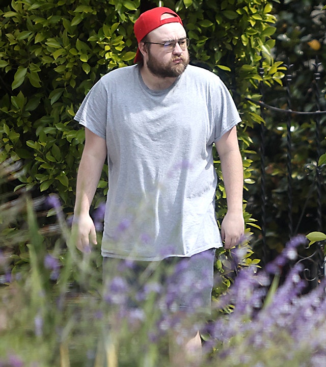 Angus T. Jones sported a backwards red cap and grey shirt while out and about in Los Angeles.