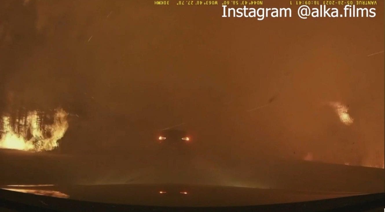 Stunning video shows Canada wildfire nearly engulfing driver on both sides: 'Go, go'