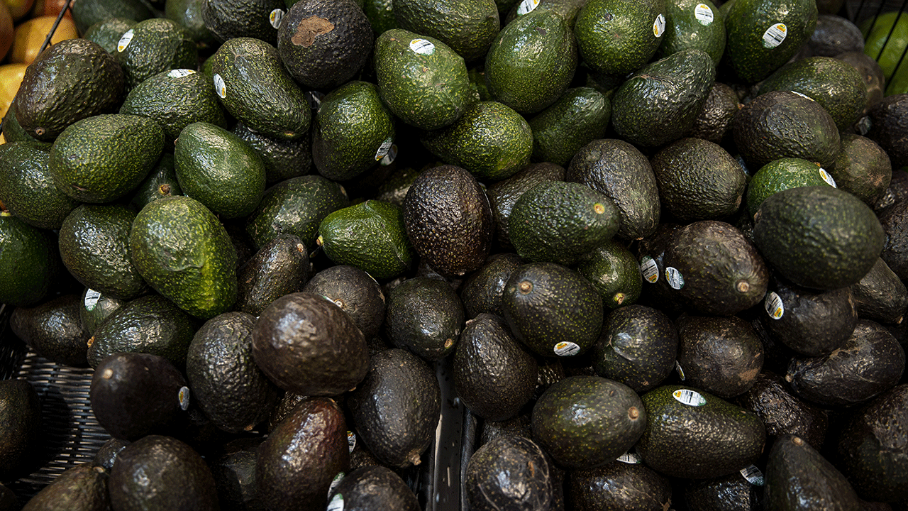 a pile of avocados