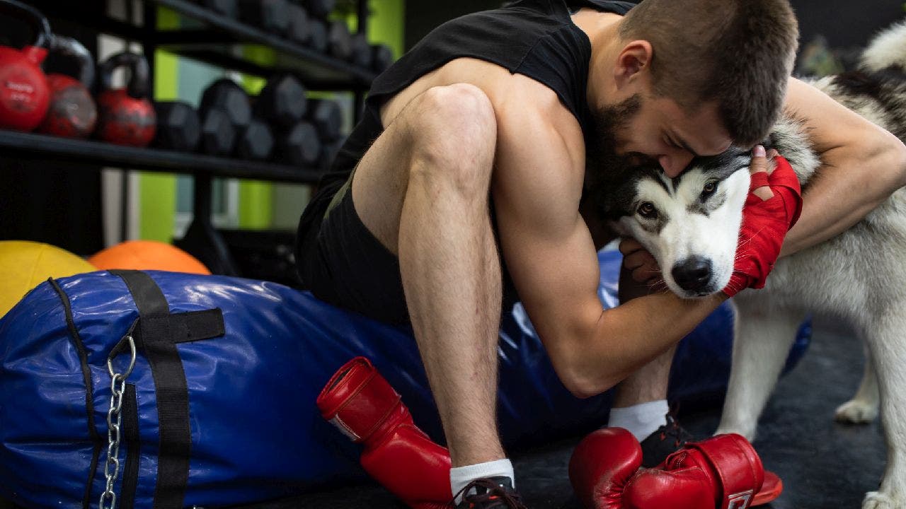 Man asks if he's wrong for bringing his dog to the gym, sparking debate on Reddit