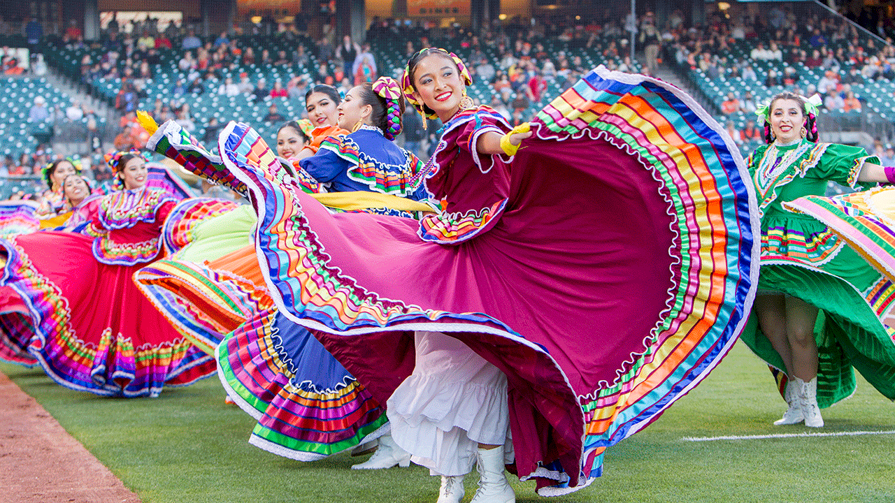 Mexican dancers dancing at an MLB game
