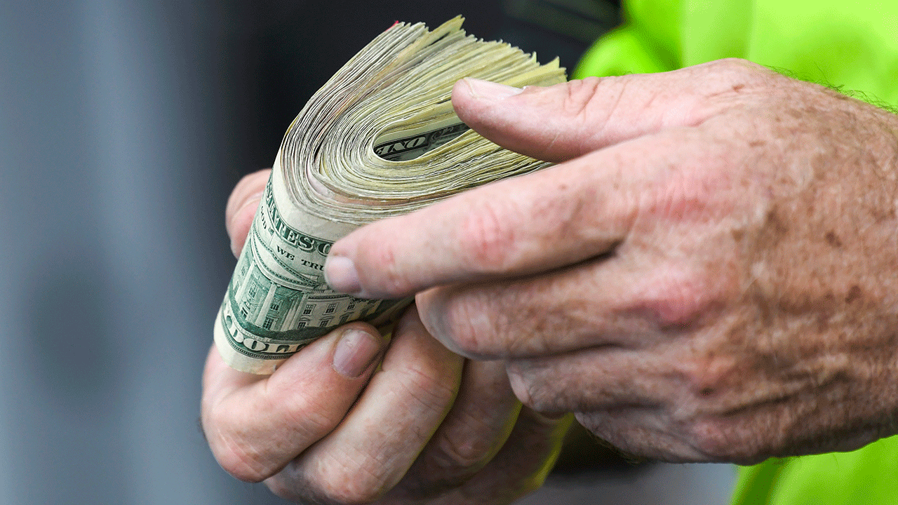 Hands holding money