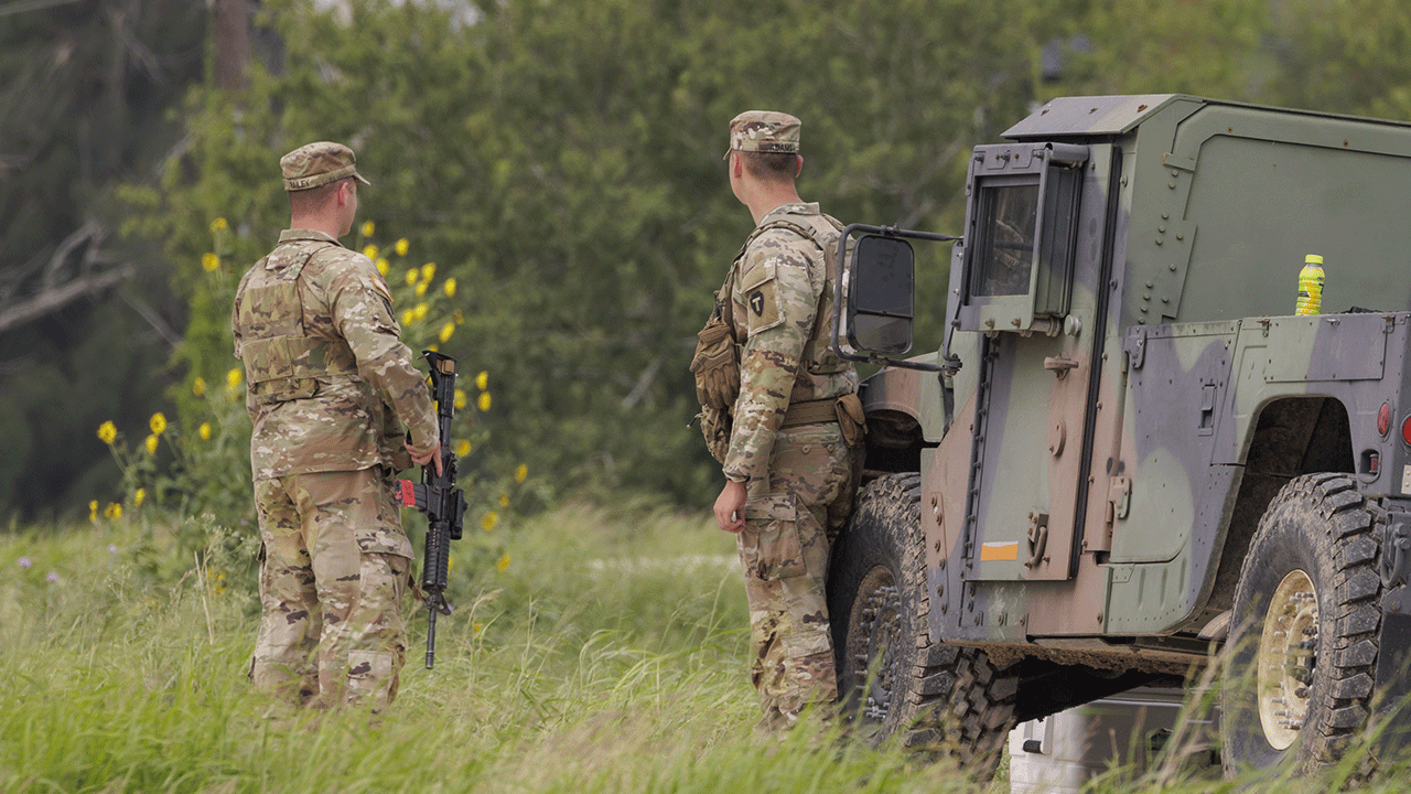 Two soldiers talking at the border