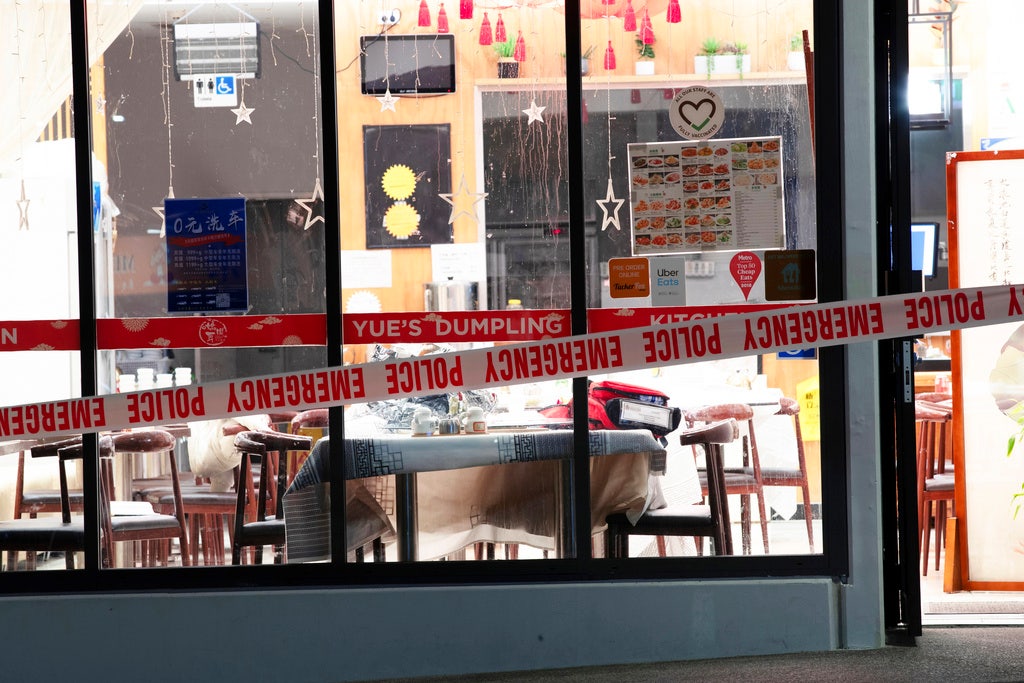 Ax-wielding attacker goes on rampage in restaurants as patrons flee in panic