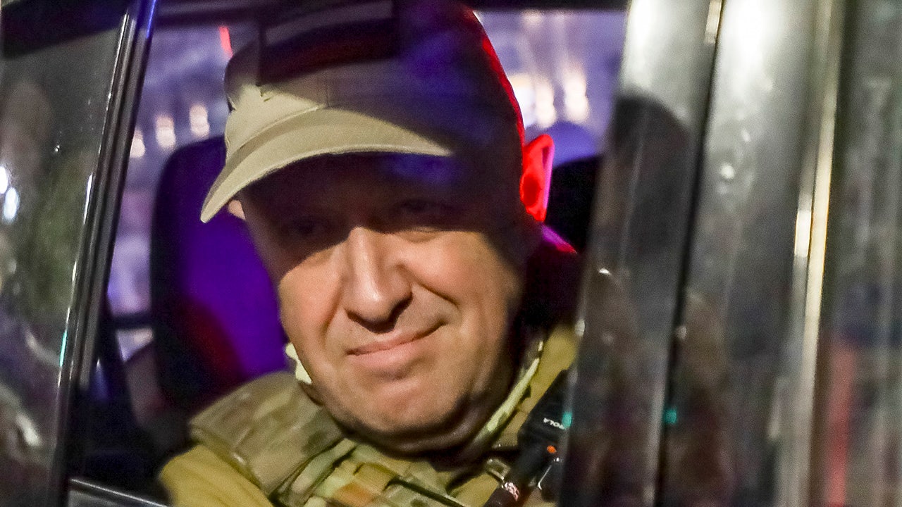 Prigozhin looks on from a street vehicle in Russia