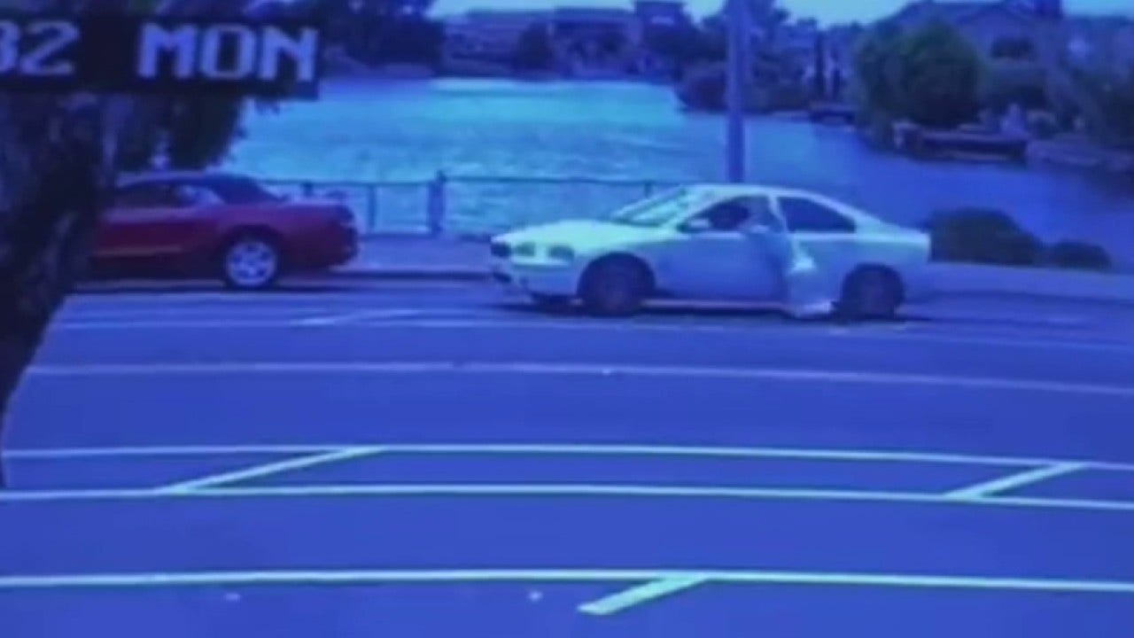 California robbery victim dragged by car while trying to stop purse snatcher, video shows